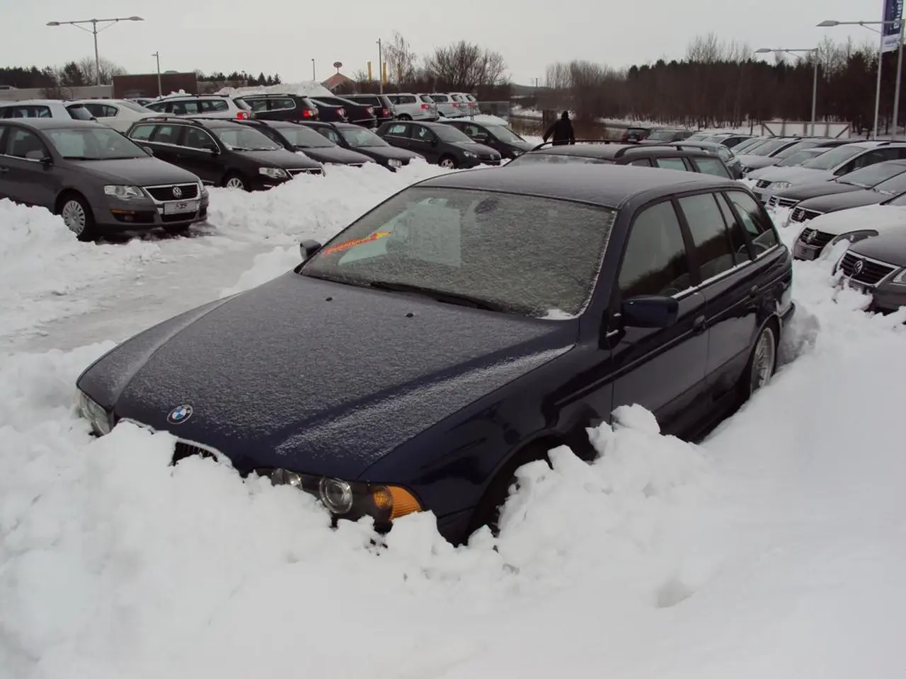 In the middle of this image, there is a vehicle on a road, on which there are other vehicles, a...