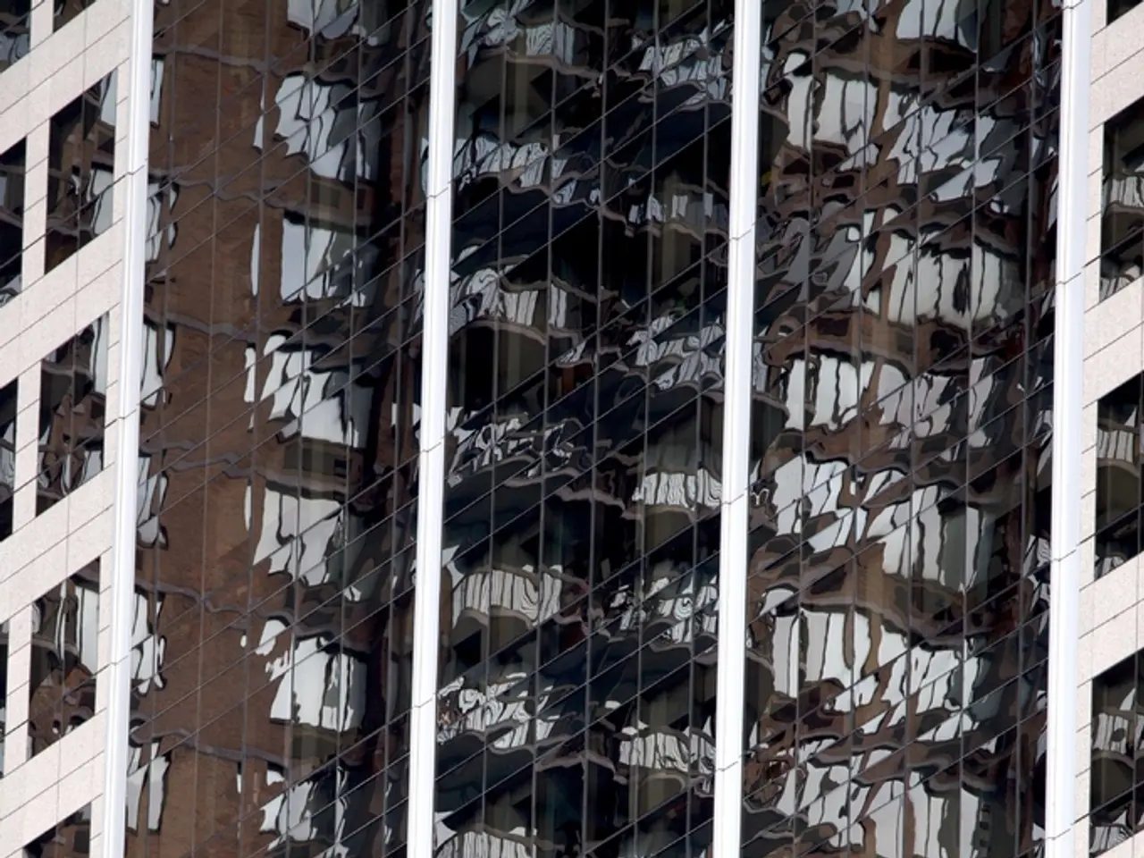 In this image, we can see there are buildings which are having windows.