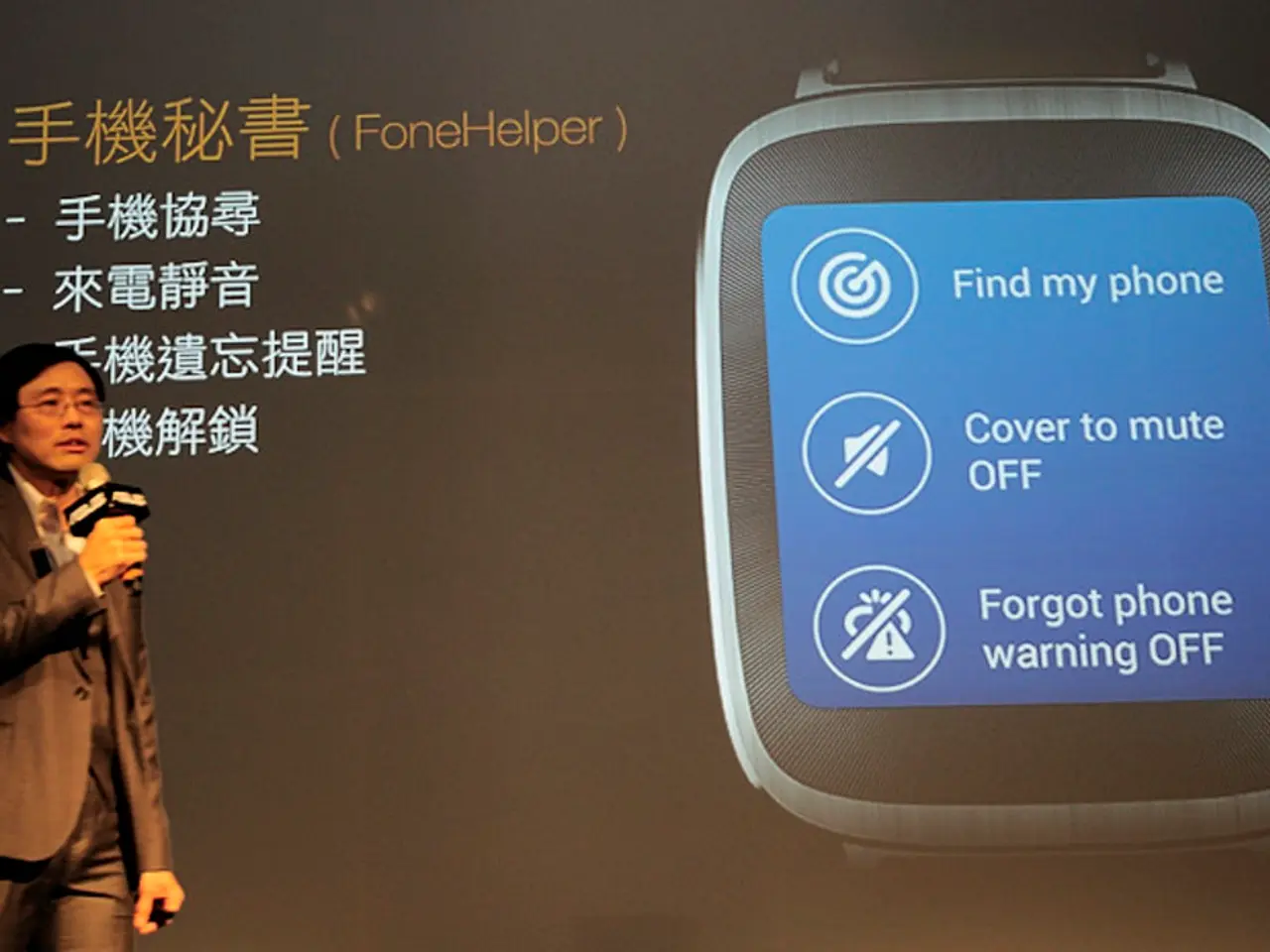 Here in this picture we can see a person in a suit, speaking something in the microphone present in...