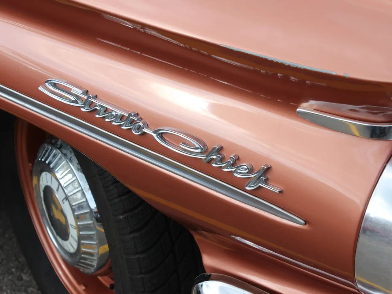 In the picture I can see a vehicle on which there is something written on it.