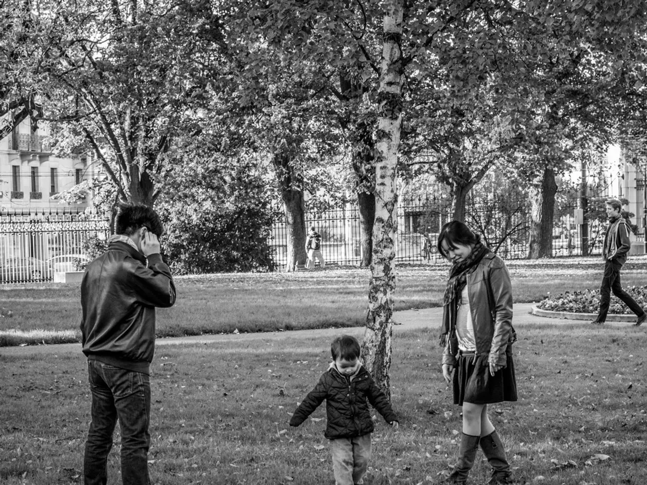 This is the picture of a place where we have some people on the grass floor and behind there are...