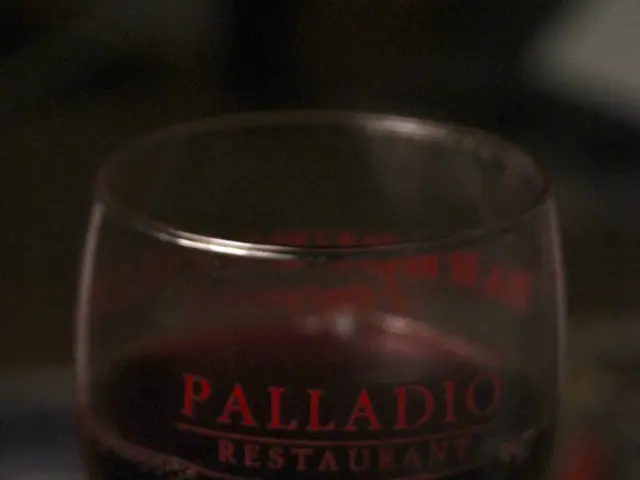 In this picture we can see a glass with drink in it and in the background it is blurry.