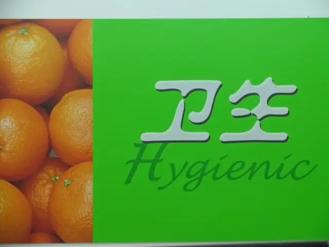 In this image there is a photo of oranges and there are two words on the paper.