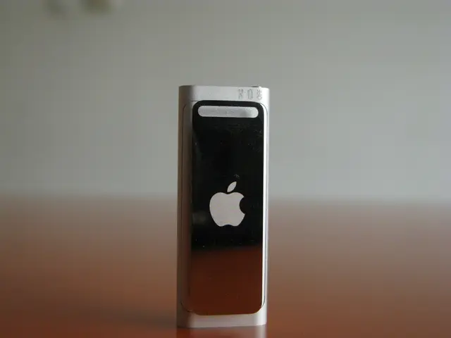 In this image we can see a device with a logo which is placed on the surface.